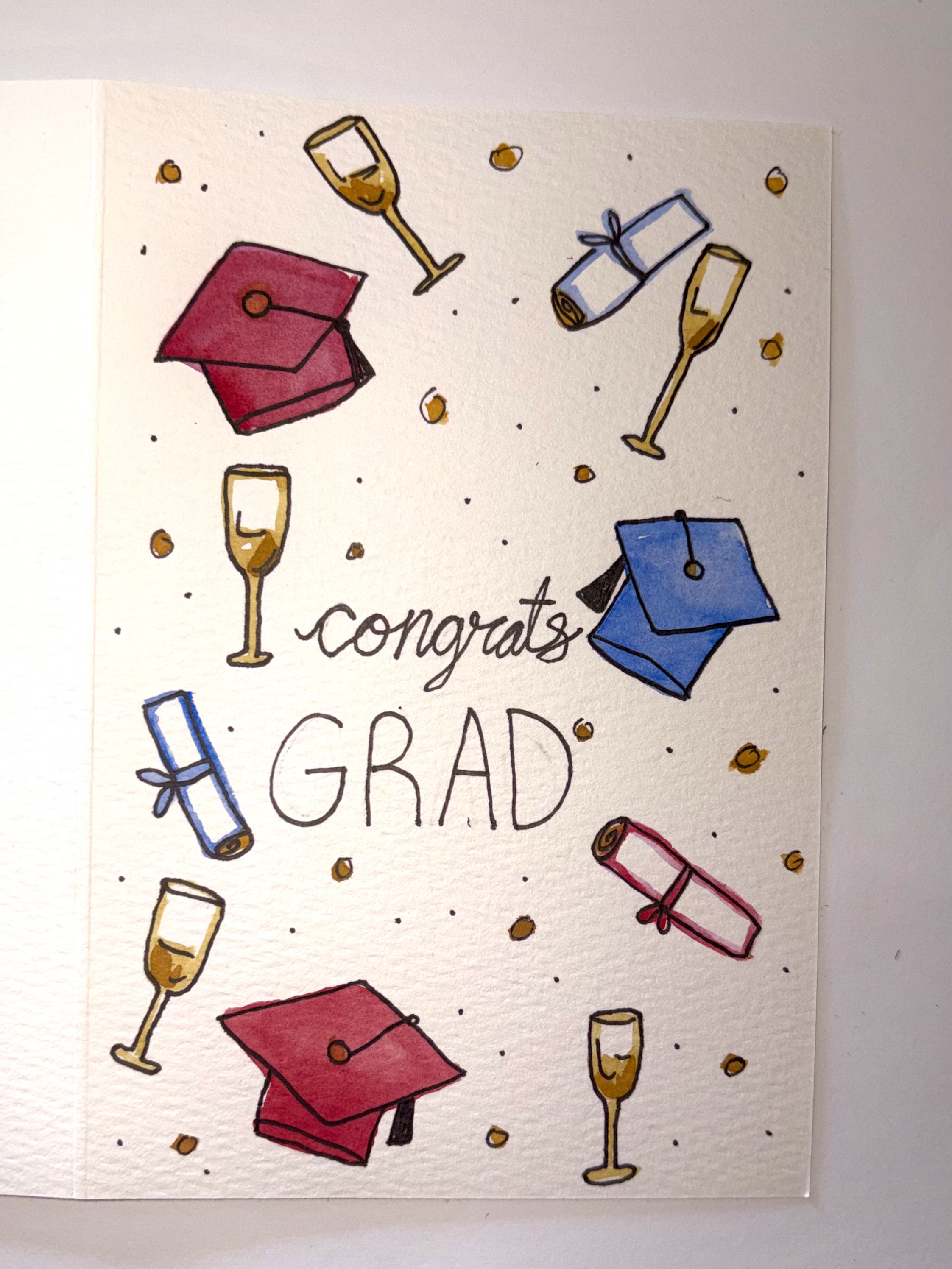Graduation card with watercolor caps, diplomas and champagne glasses